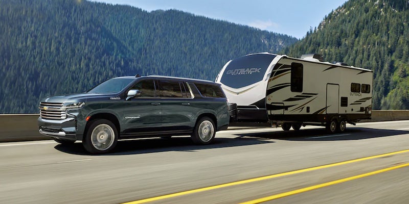 Suburban towing camper trailer