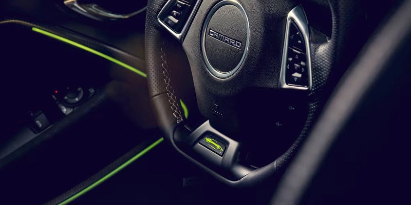 Interior view of a Chevy Camaro with focus on the steering wheel
