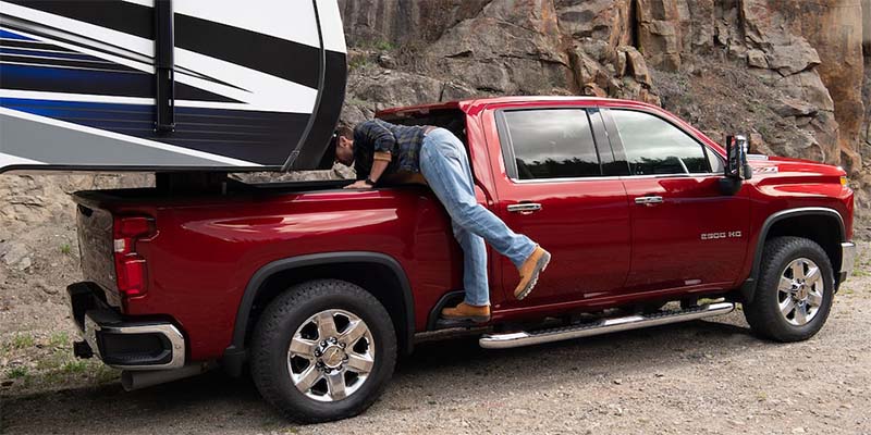 Man accessing Chevy Silverado-2500 HD bed step